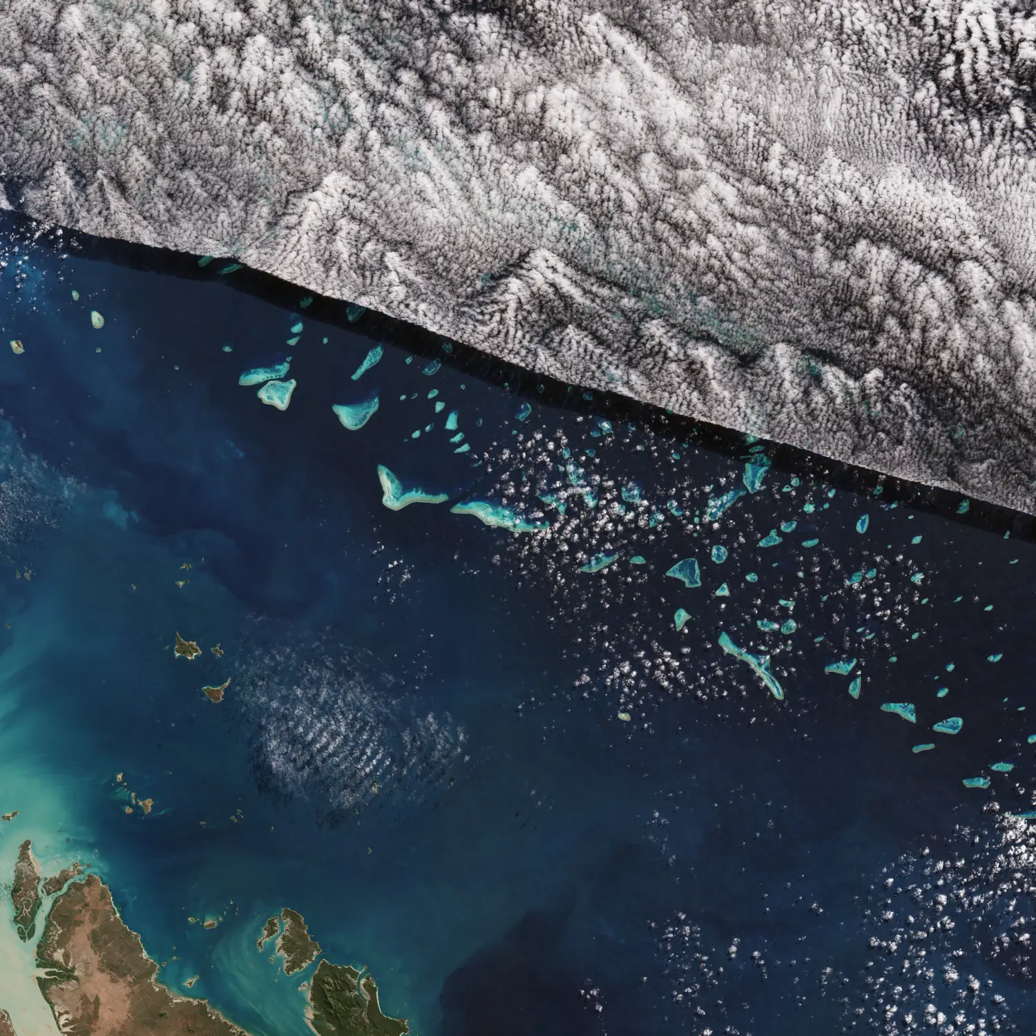 The photo shows the Great Barrier Reef in the Coral Sea off the east coast of Queensland, Australia, seen from space by Copernicus Sentinel-2.