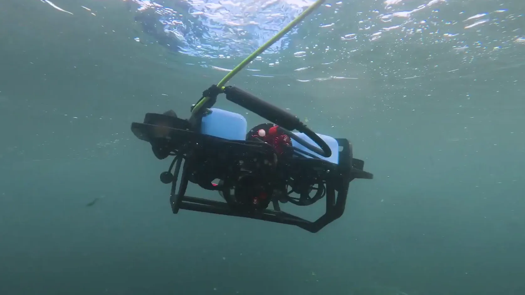 An underwater environmental robot being deployed for a scouting mission.